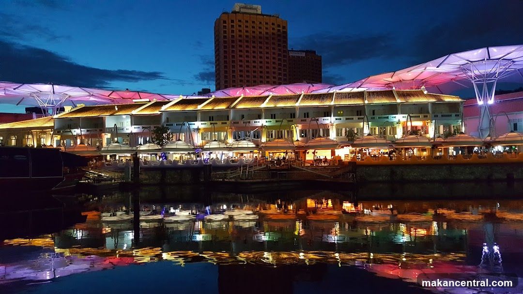Nighttime waterfront dining area