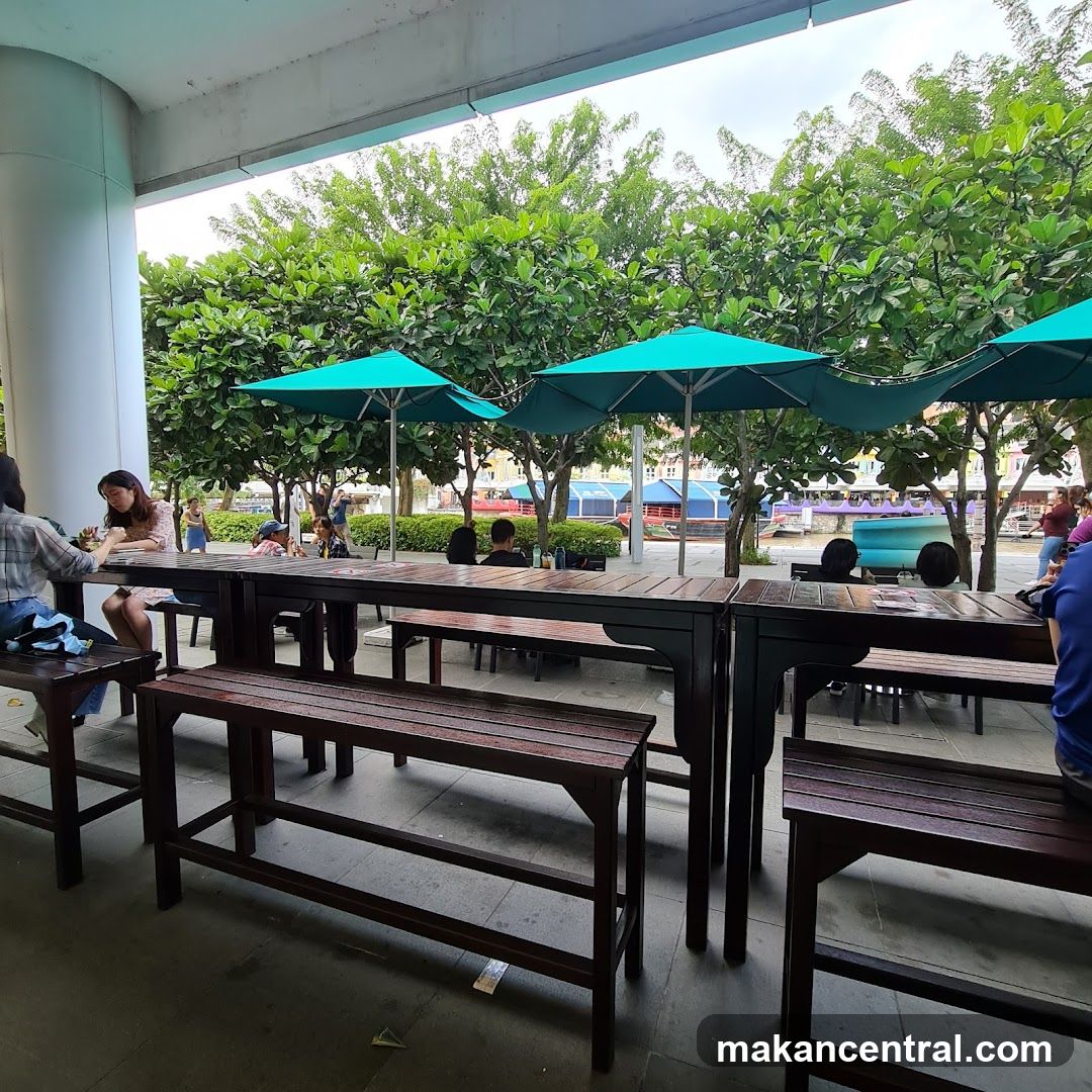Outdoor seating area with umbrellas and trees