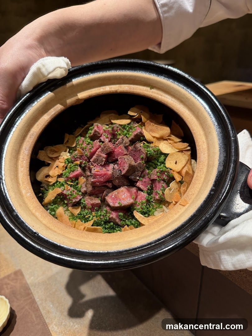 Hand holding a clay pot dish
