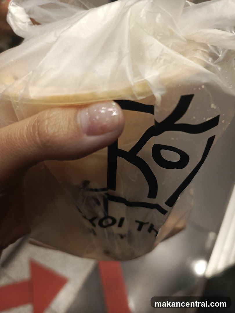 Hand holding packaged food item