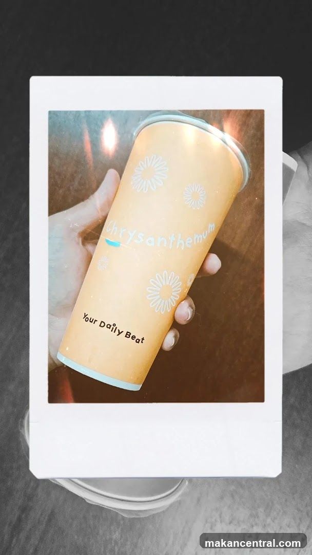 Hand holding branded cup