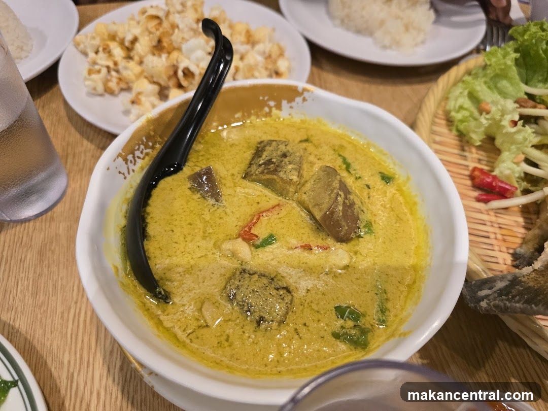 Table with Thai curry dish