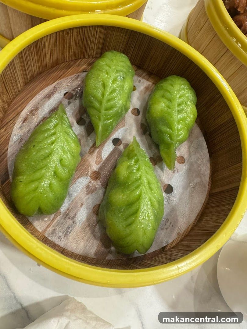 Green Leaf-Shaped Dumplings in Bamboo Steamer