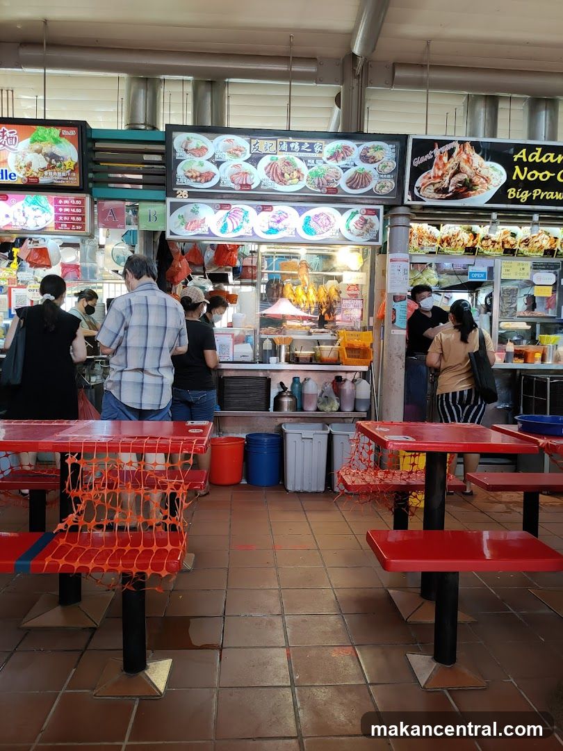 Food court interior with red tables and stools