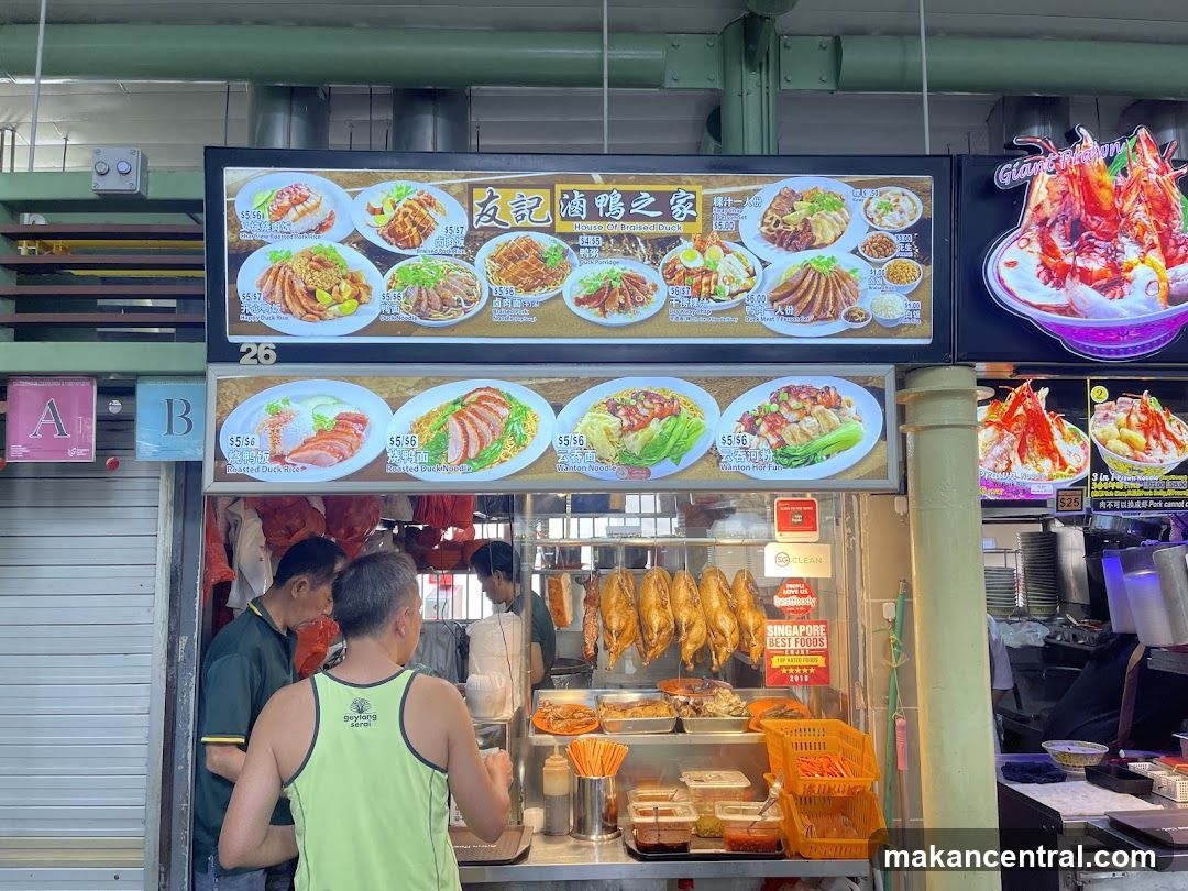 Food stall interior with customers and staff