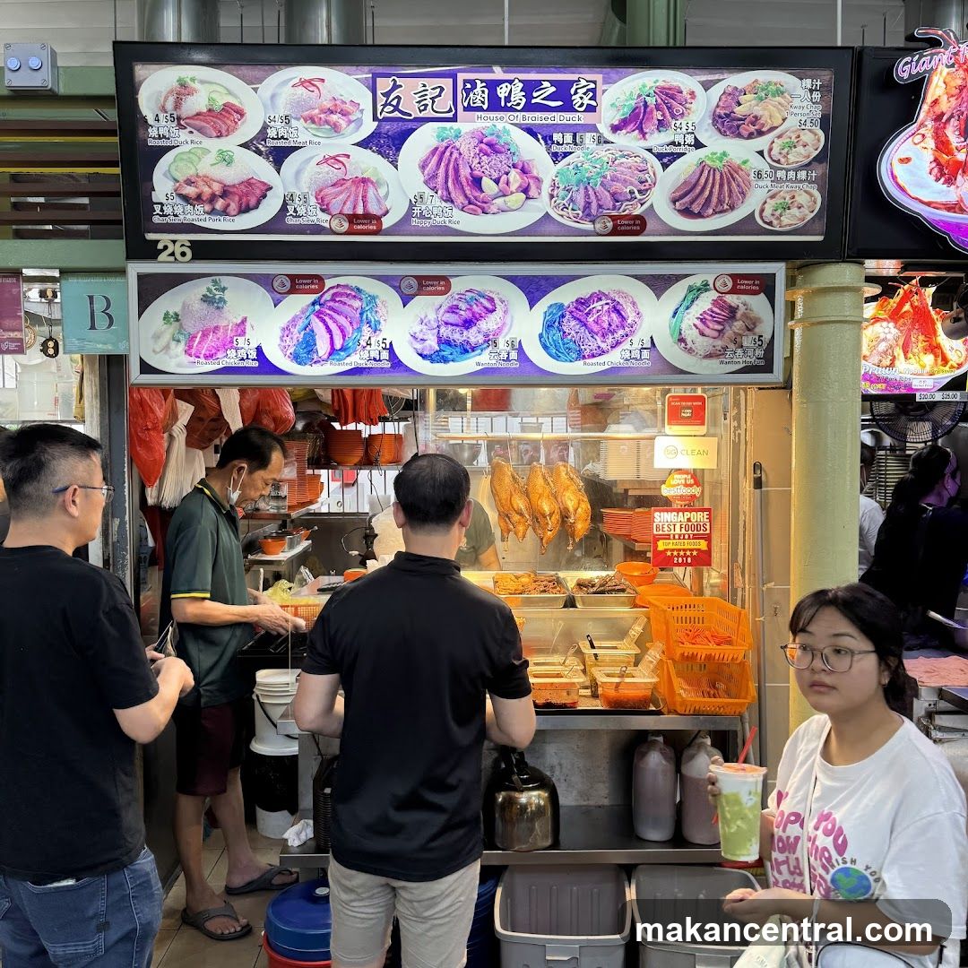 Food stall interior with customers and staff