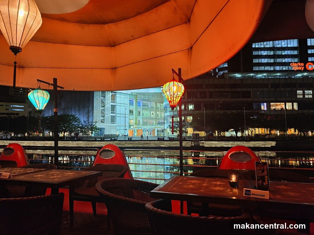 Nighttime riverside dining area