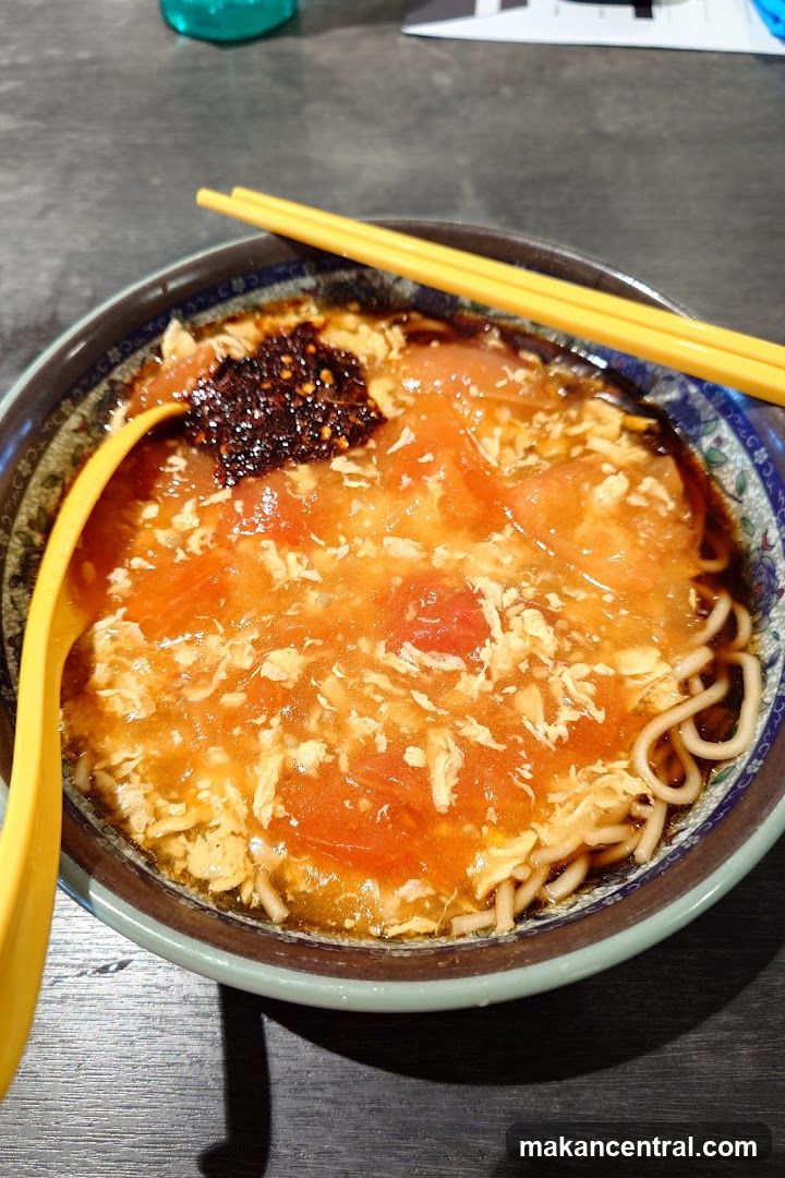 Noodle Bowl with Chopsticks and Spoon