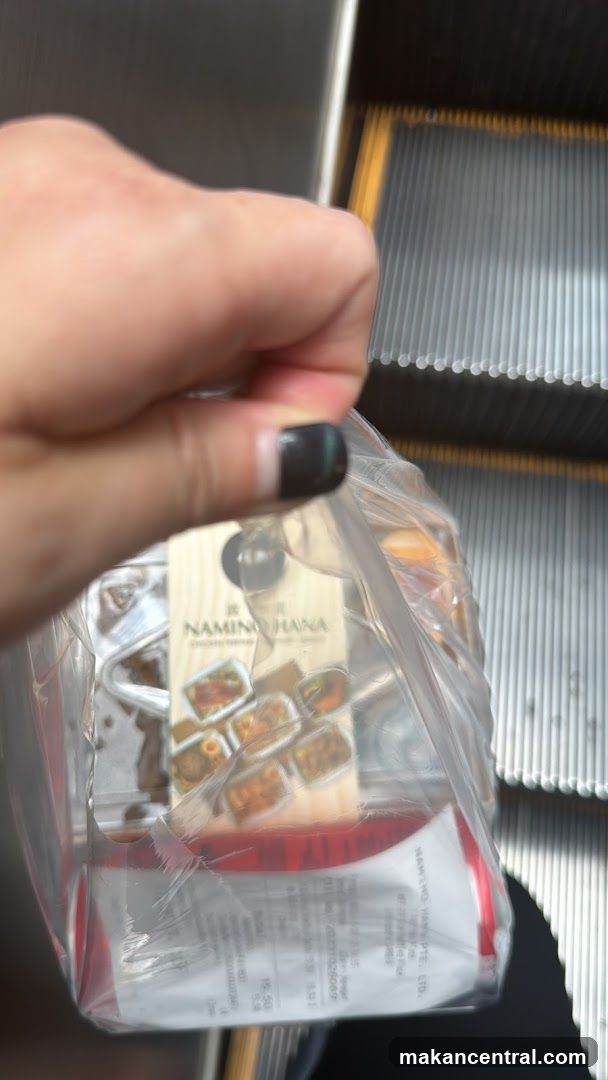 Hand holding packaged food item
