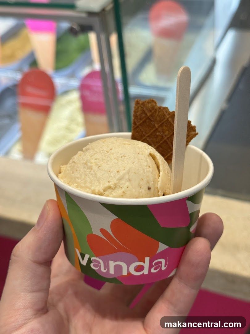 Hand holding ice cream cup