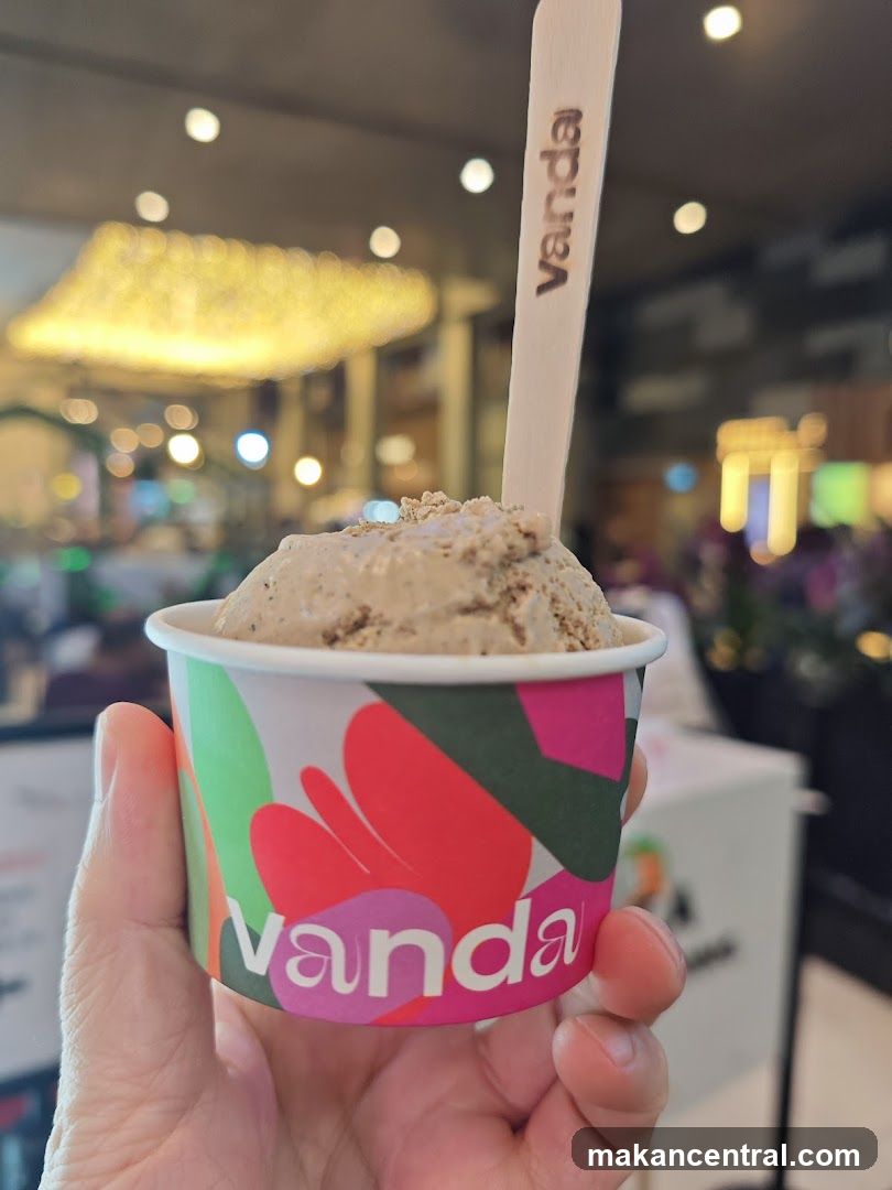 Hand holding ice cream cup