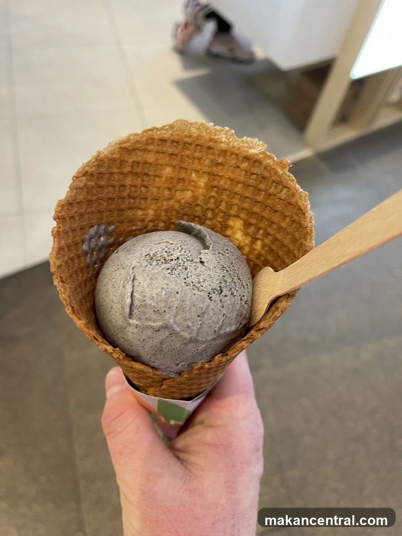Hand holding ice cream cone