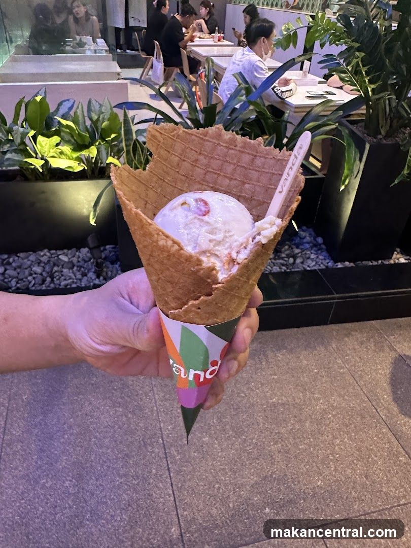 Hand holding ice cream cone