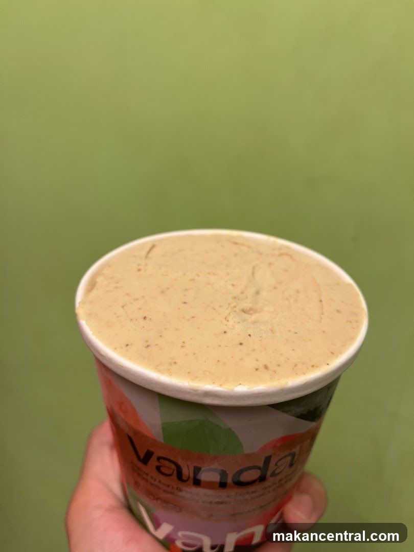 Hand holding ice cream cup