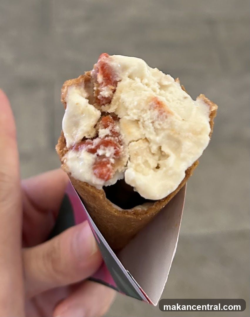 Hand holding ice cream cone