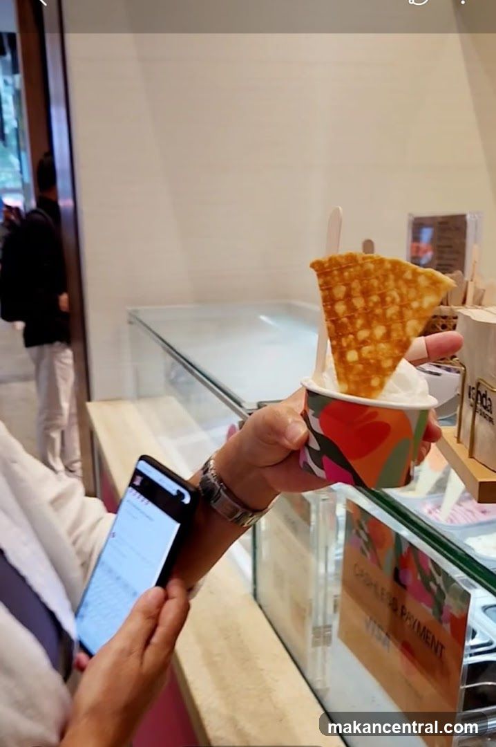 Customer holding dessert
