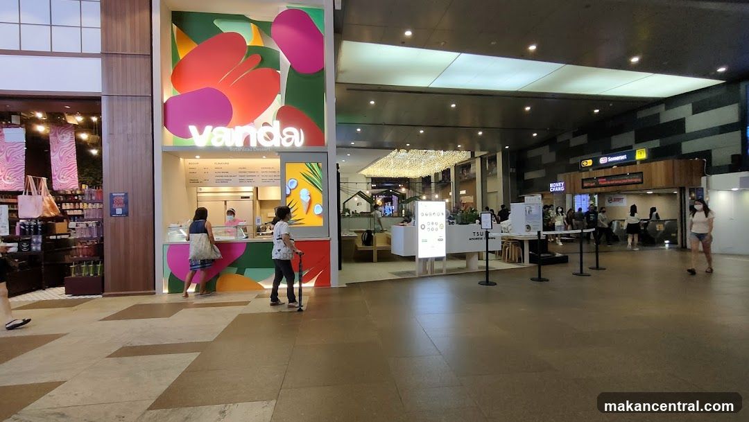 Interior of shopping mall with VandA storefront