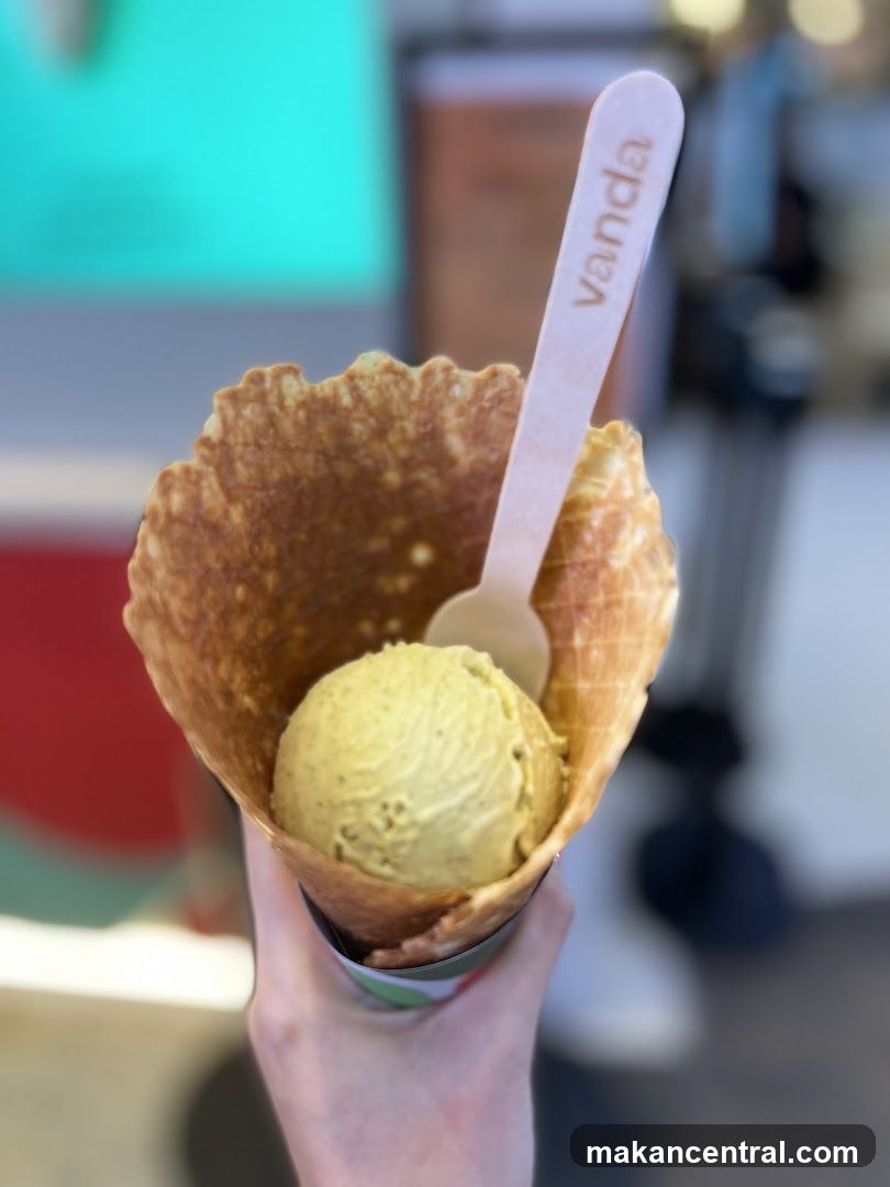 Hand holding ice cream cone