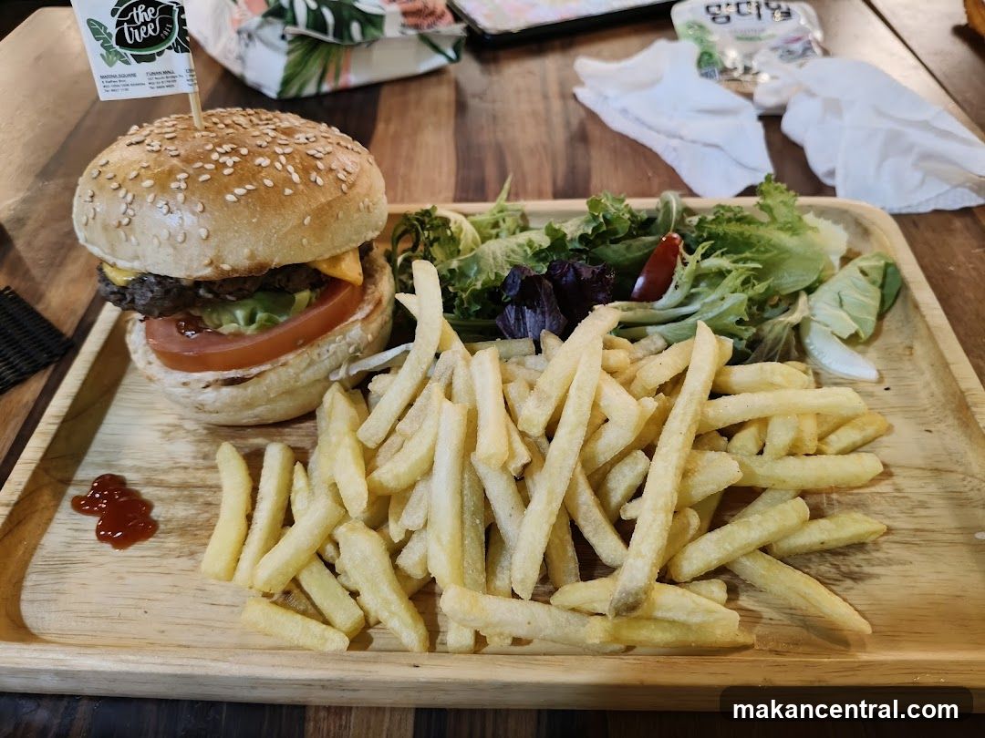 Burger and fries on wooden tray