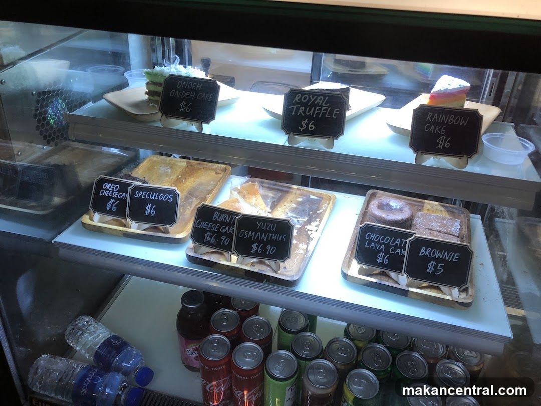 Display Case with Cakes and Beverages