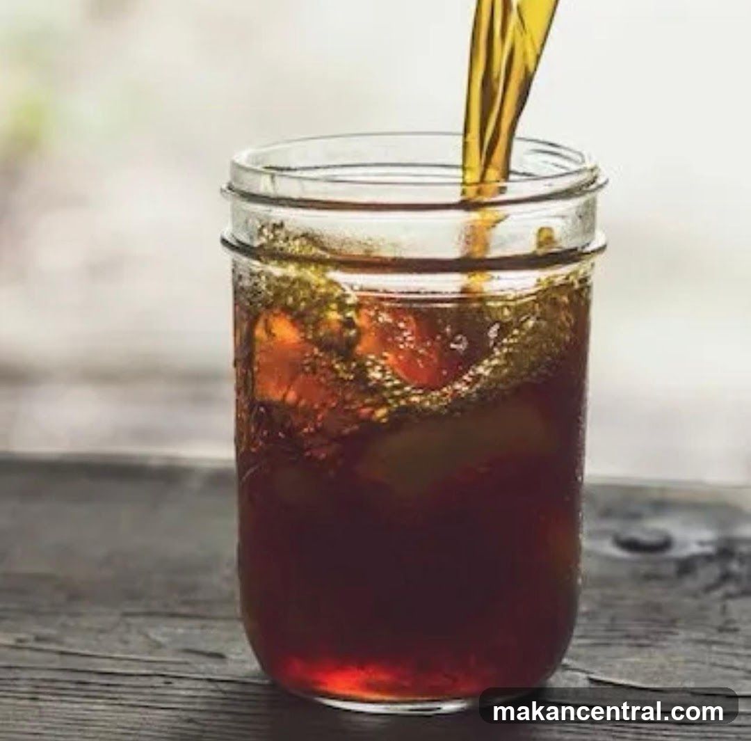Pouring beverage into mason jar