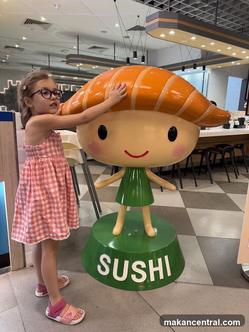 Child with Sushi Statue in Restaurant Interior