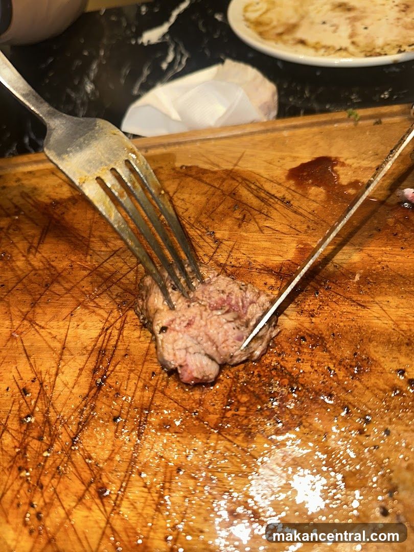 Cutting meat on wooden board