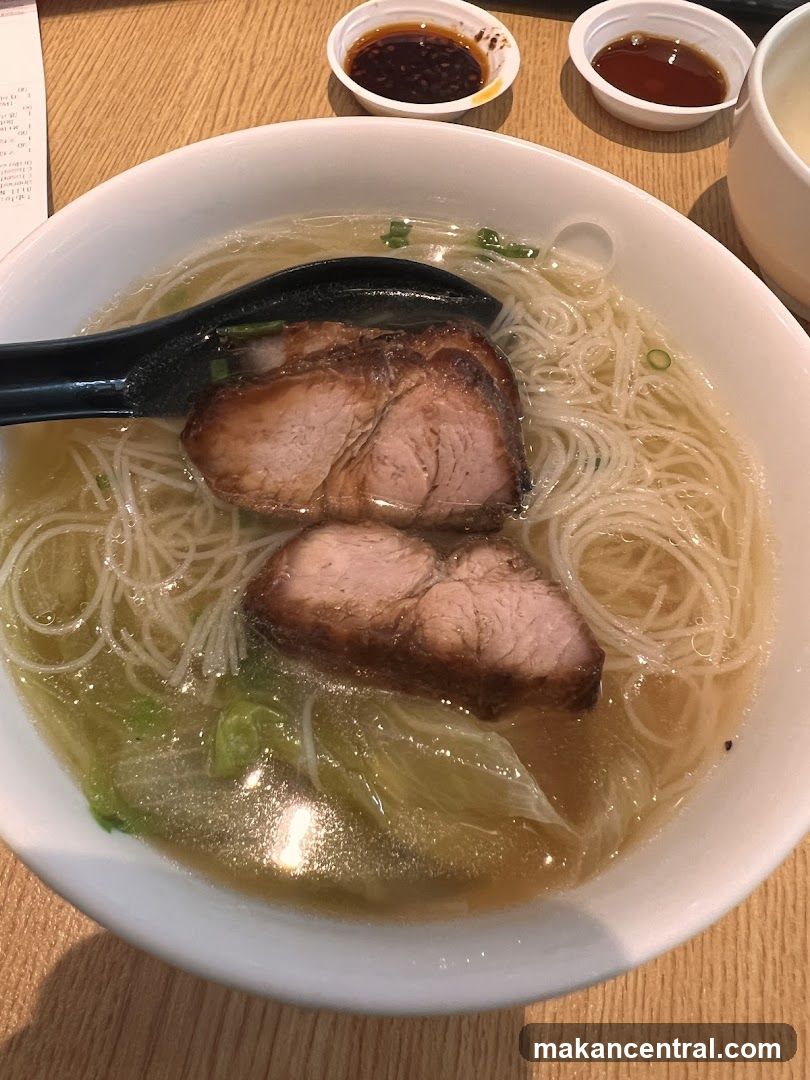 Ramen bowl with pork slices and noodles