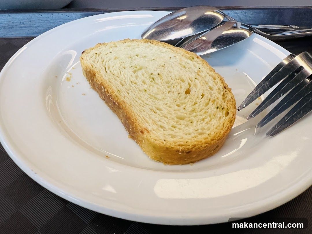 Bread on Plate with Cutlery