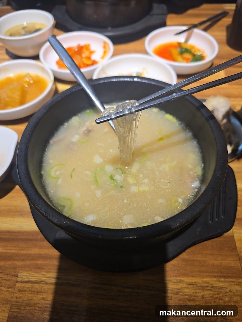 Dining Table with Soup and Side Dishes