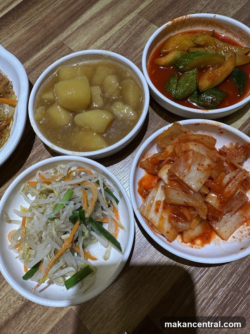 Korean side dishes on wooden table