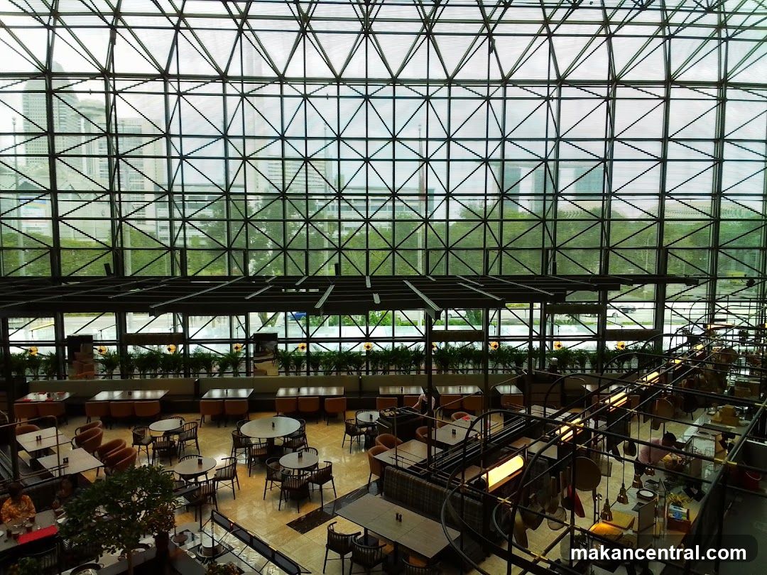 Interior of a large glass-roofed dining space