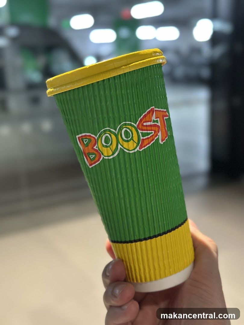 Hand holding Boost cup