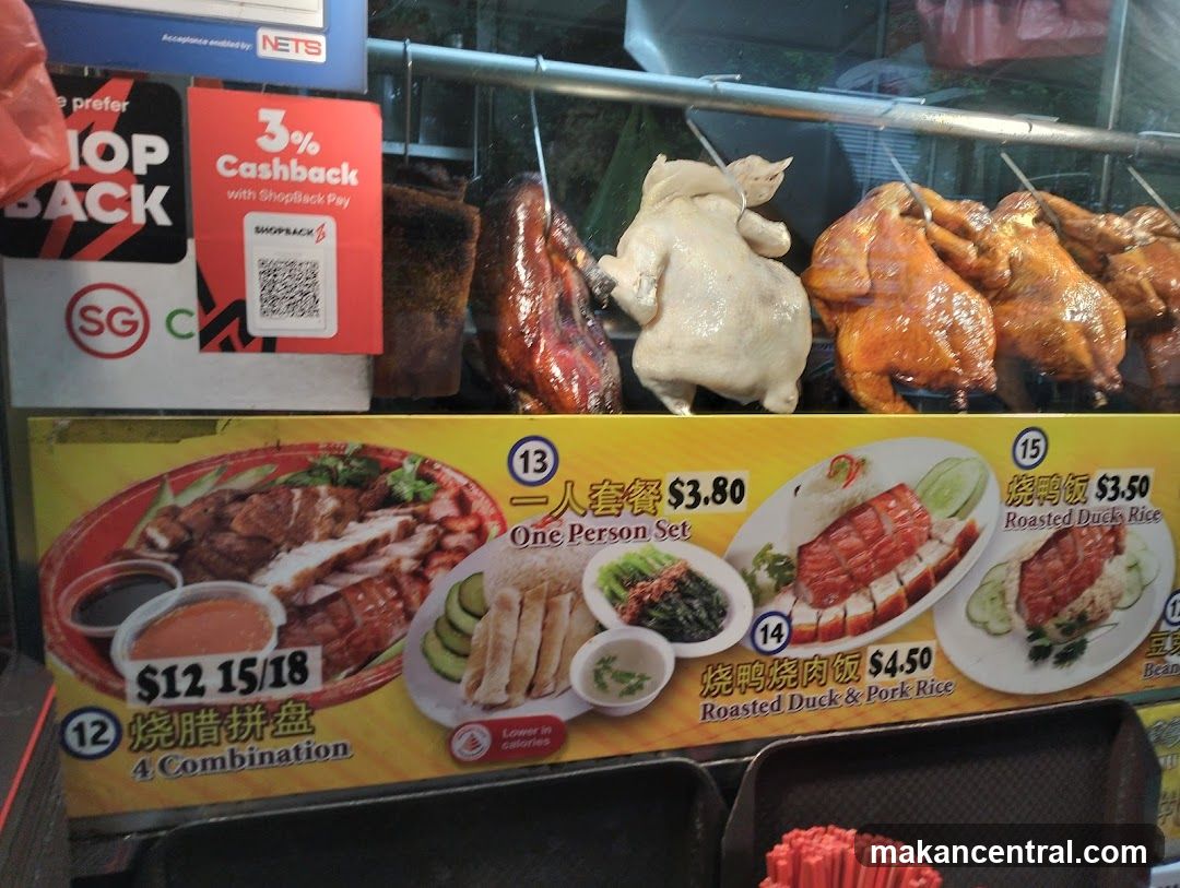 Roasted meat display with promotional signage