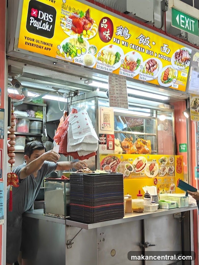 Food stall interior with staff preparing food