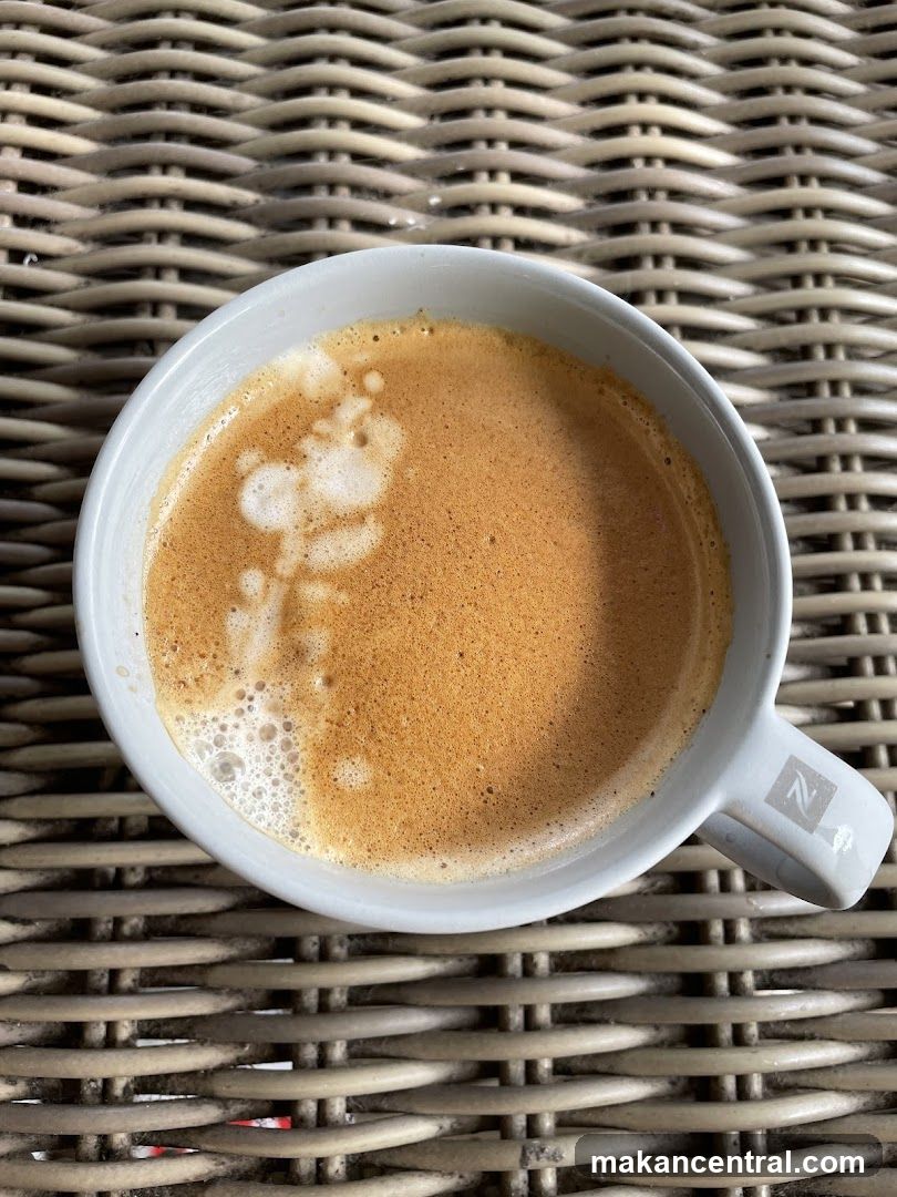 Coffee in a mug on woven surface