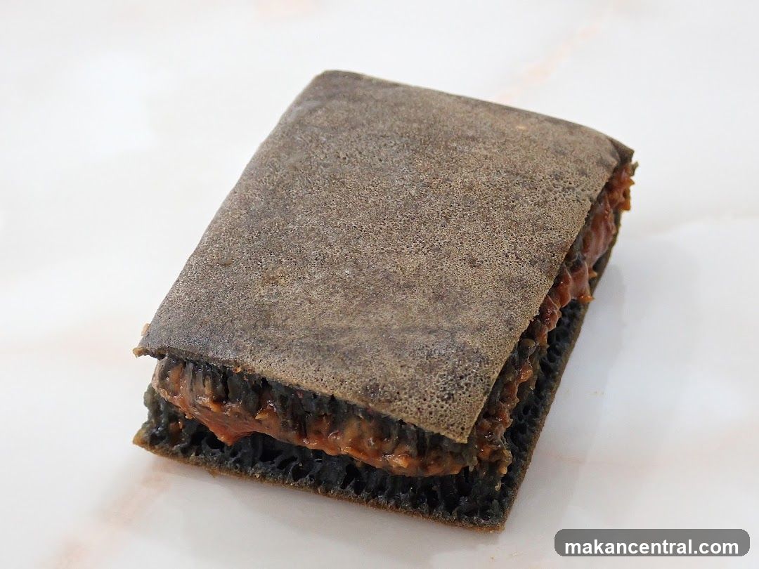 Dark-colored layered dessert