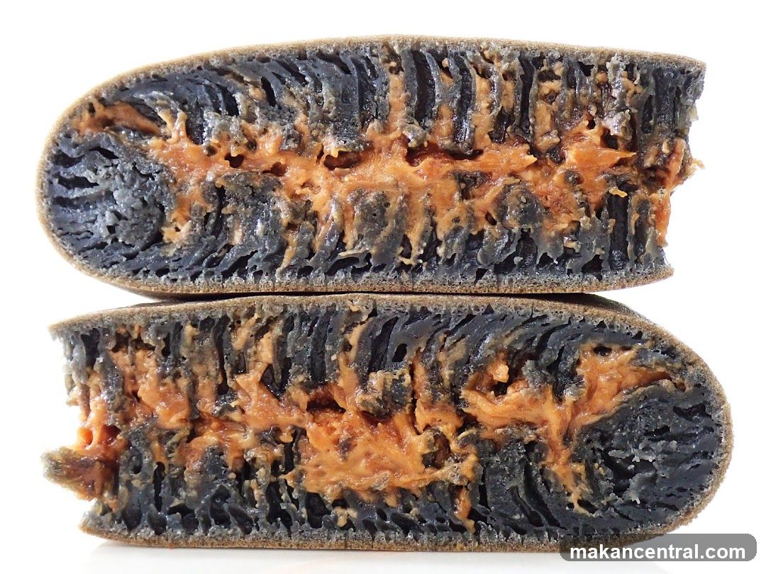 Cut open dark bread with peanut butter filling