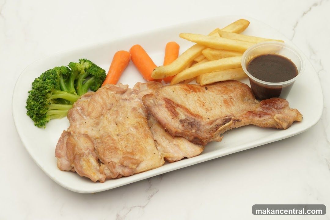 Pork Chop Plate with Fries and Vegetables