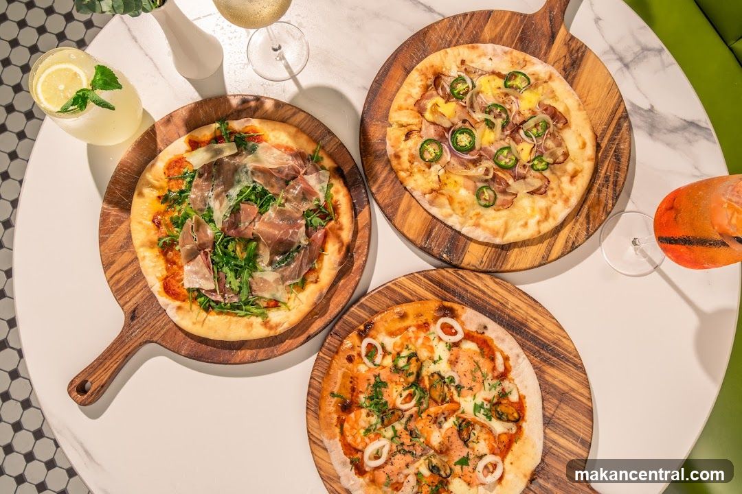 Table with pizzas and drinks