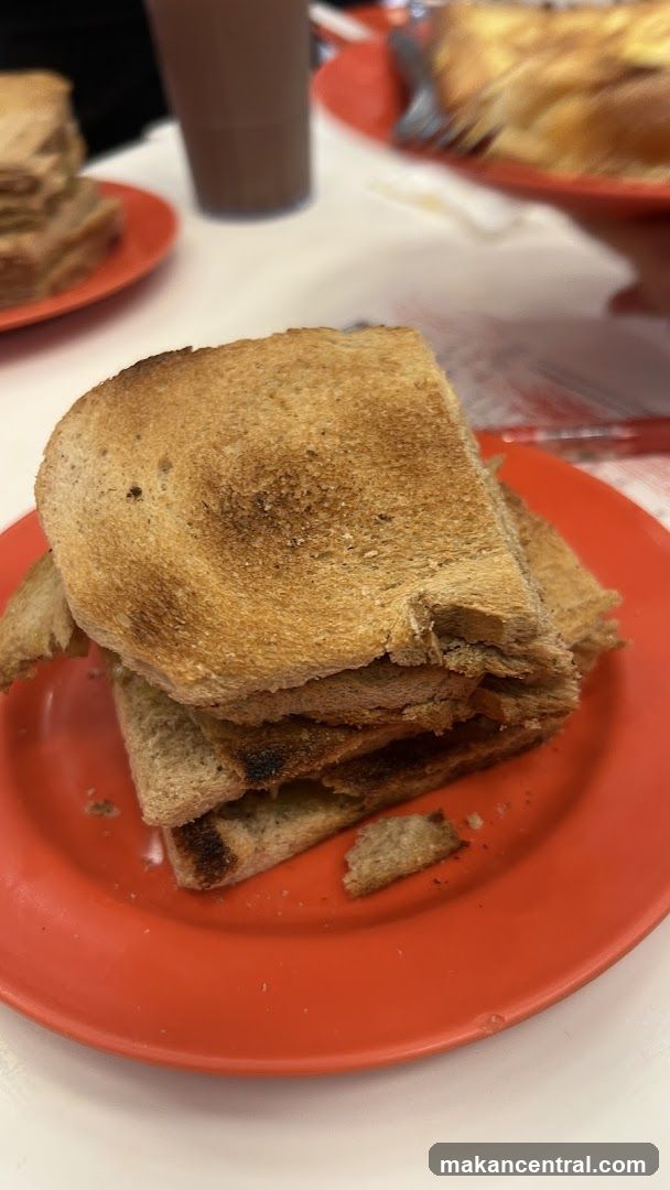 Toasted bread on red plate