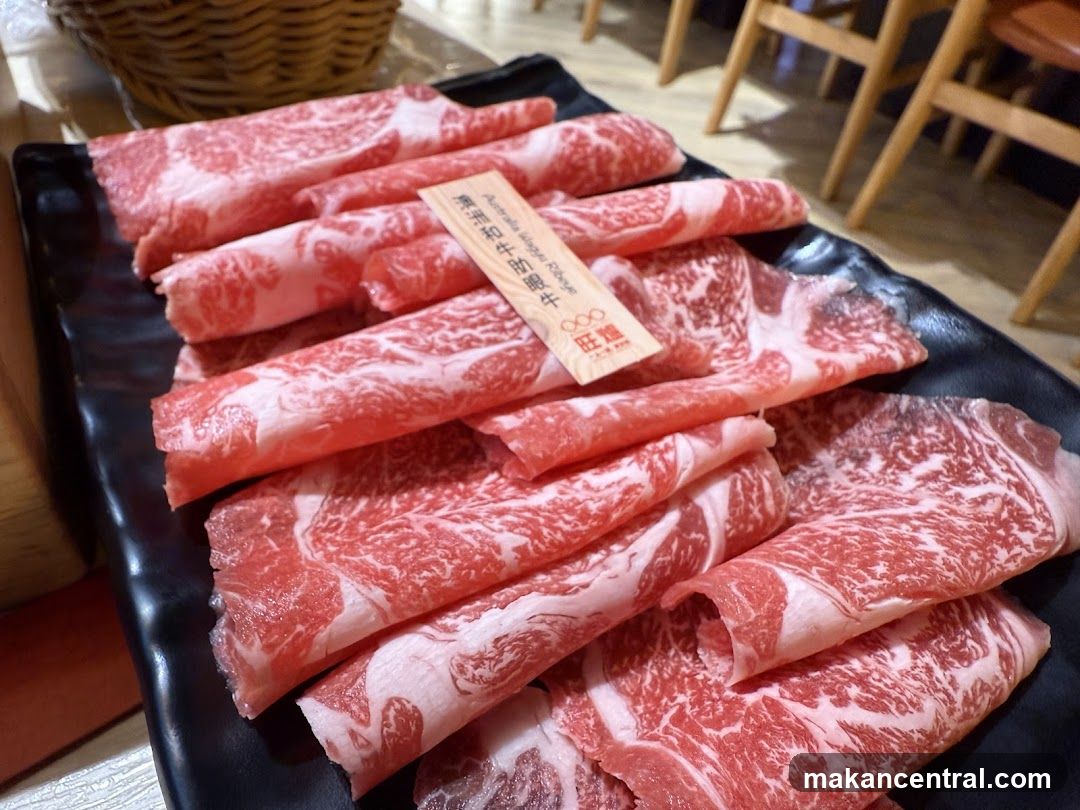 Raw Meat Slices on Black Plate
