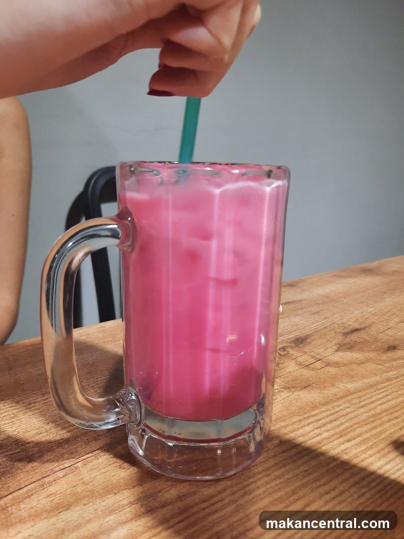Pink beverage in mug with straw