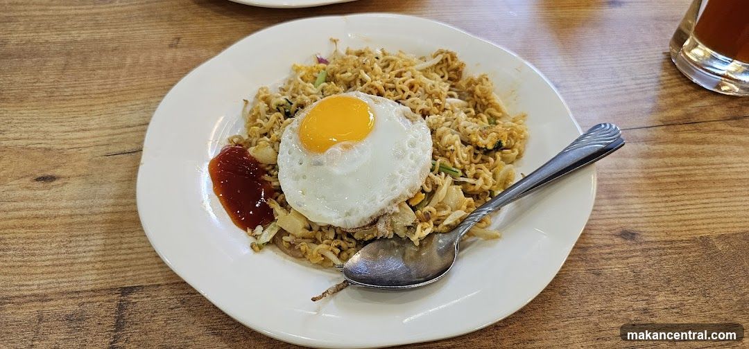 Noodles with Fried Egg on Plate
