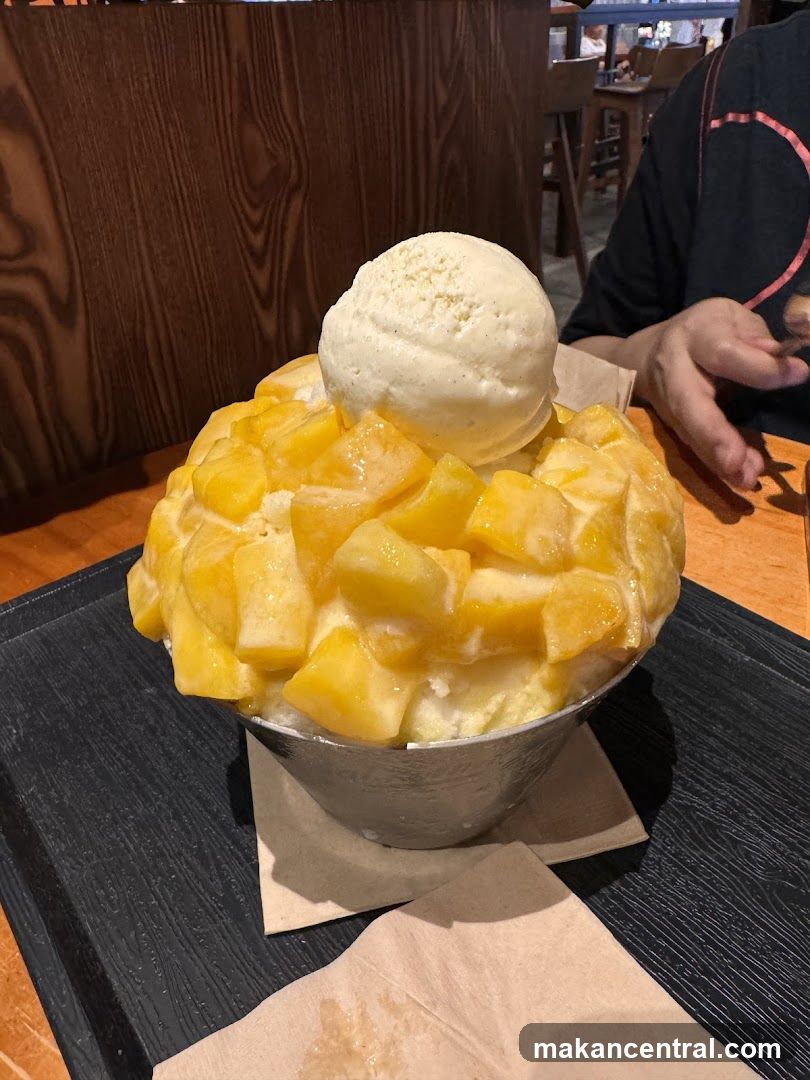 Bibimbap-style dessert with mango and ice cream