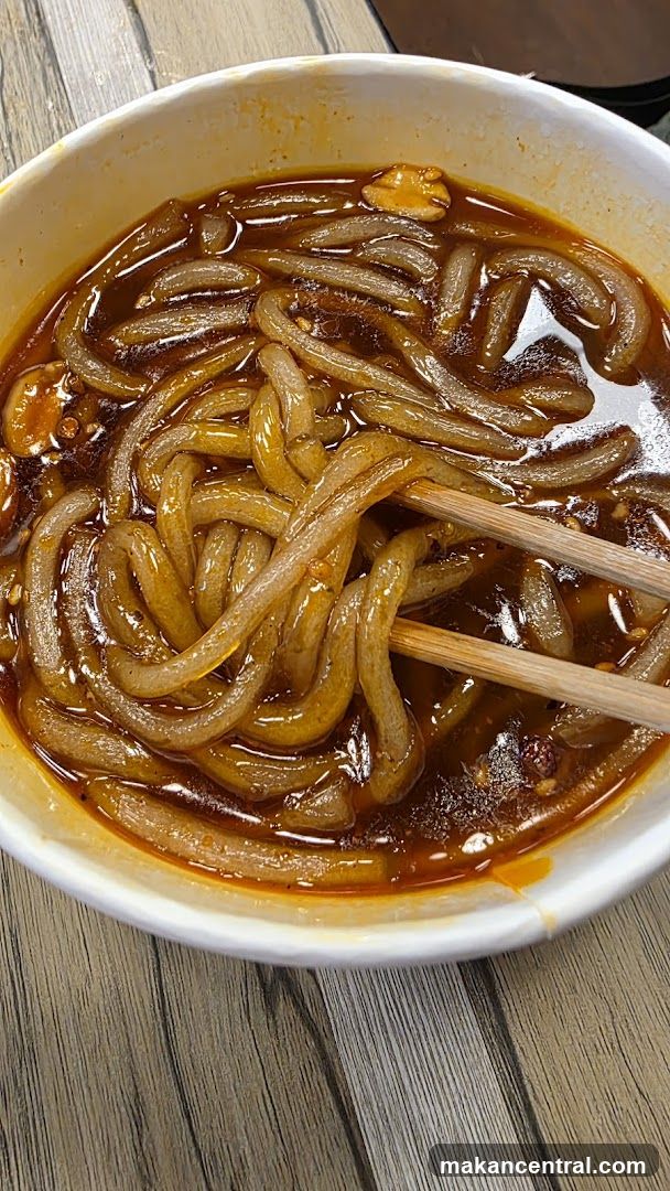 Noodles in bowl with chopsticks