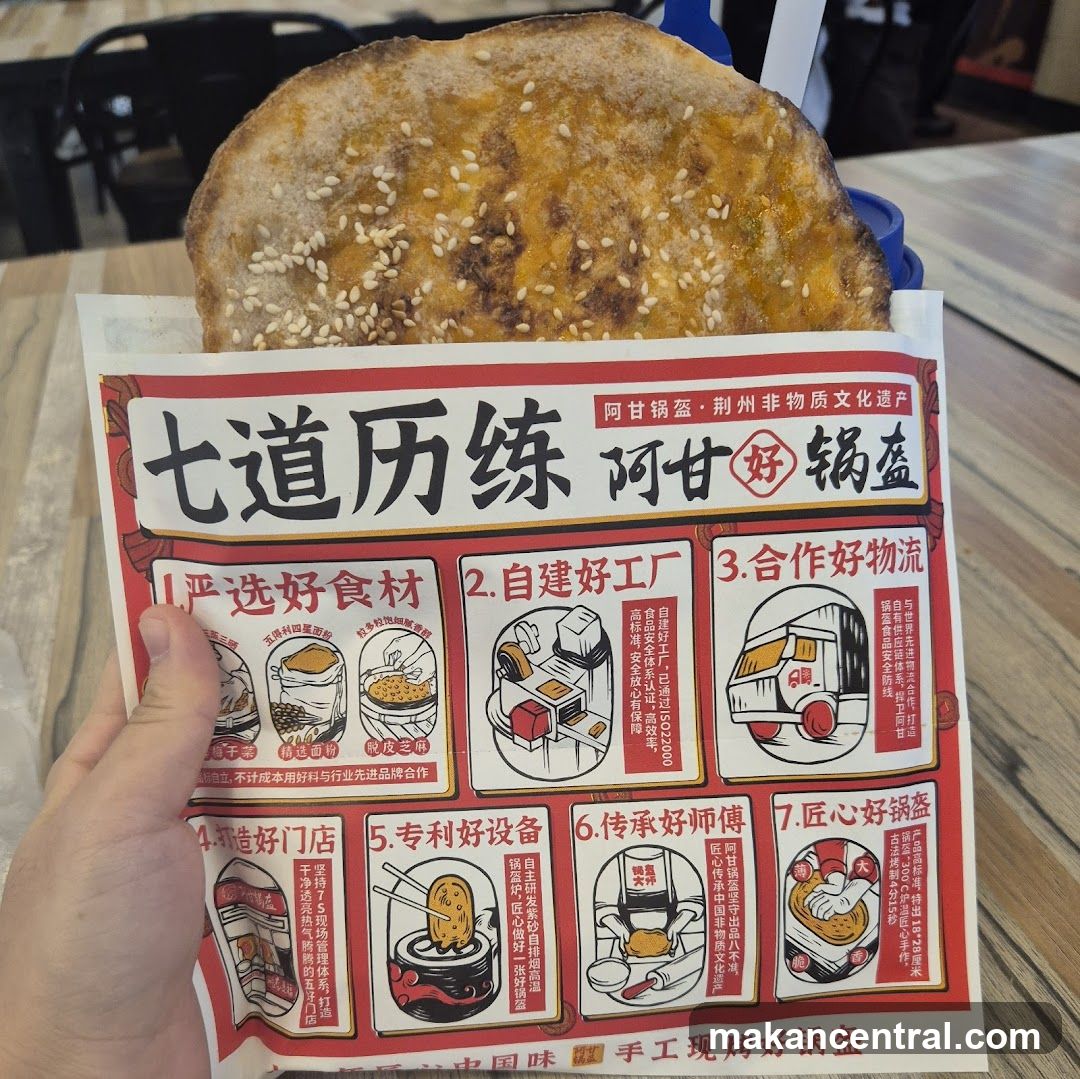 Hand holding promotional flyer with food item