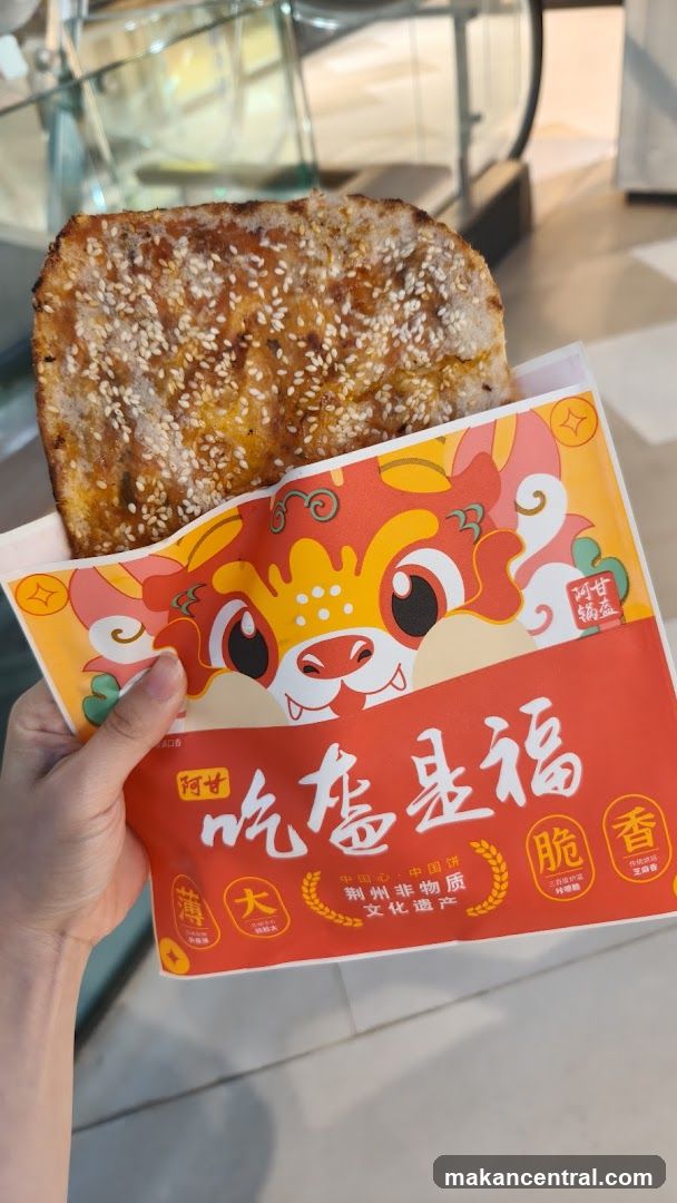 Hand holding packaged food item