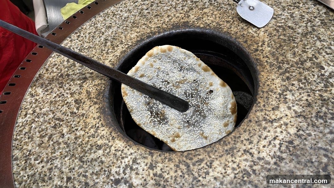 Food being cooked in a stone oven