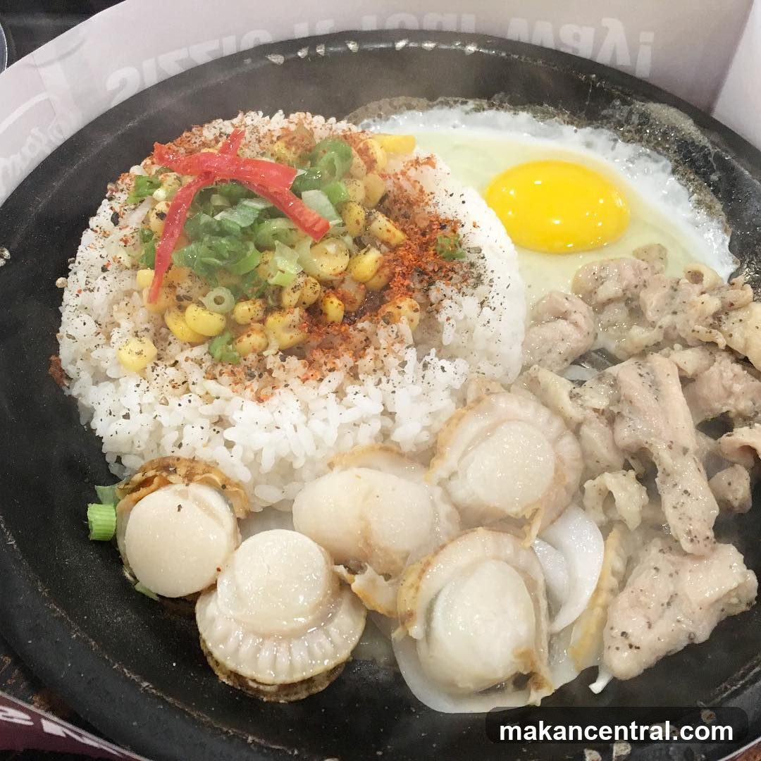 Stir-fried rice dish in a black skillet